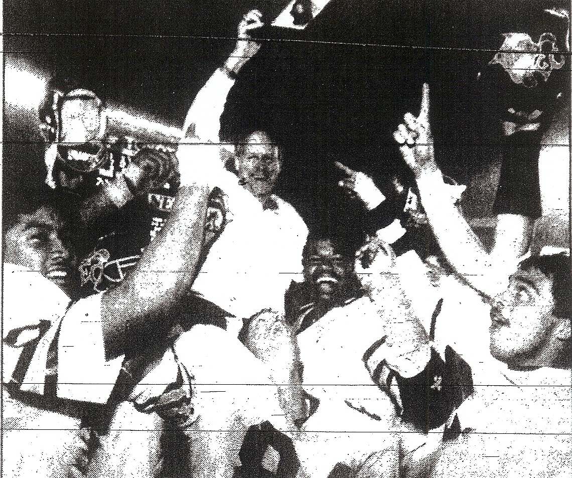 Madlanganham (lower left) and teammates gave El Camino coach Meyer victory ride.