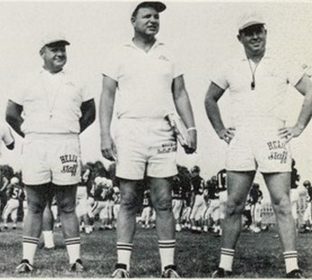 Vinton (cnter) was joined at a 1967 practice with assistants Tom Feeser (left) and Bill White.