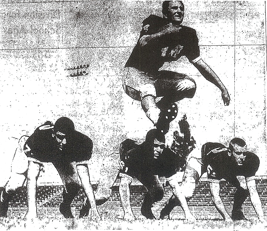 Typical publicity photo op of the era: Hoover's Walter Joe Shepich hurdles teammates Fred Greene, Lynn Johnson, and Herb Waldrop (from left) as part of Cardinals "Picture Day".