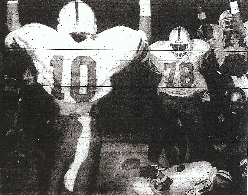 Jorge Araujo raises football after two-point con version in championship game.