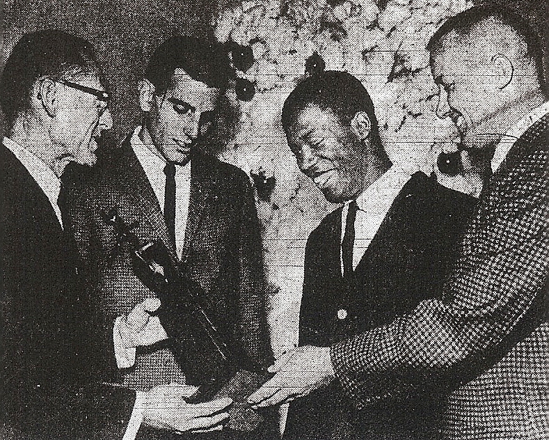 Kovac (right) and track coach Dick Coxe (left) honored track's Sterling Jenkins and football's Richard (Prime) McClendon at San Diego Junior College's 1963 fall sports awards banquet.