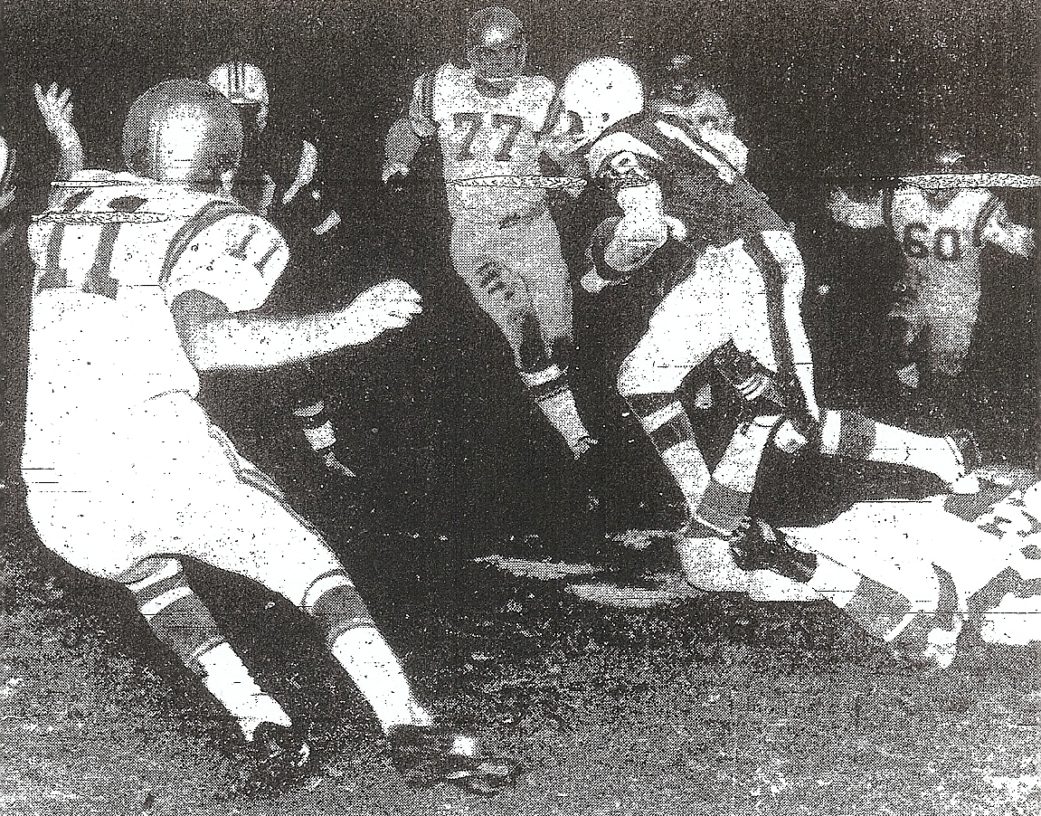 Powell cleared this traffic jam and scored on 43-yard run against St. Augustine in Metropolitan Conference title game.