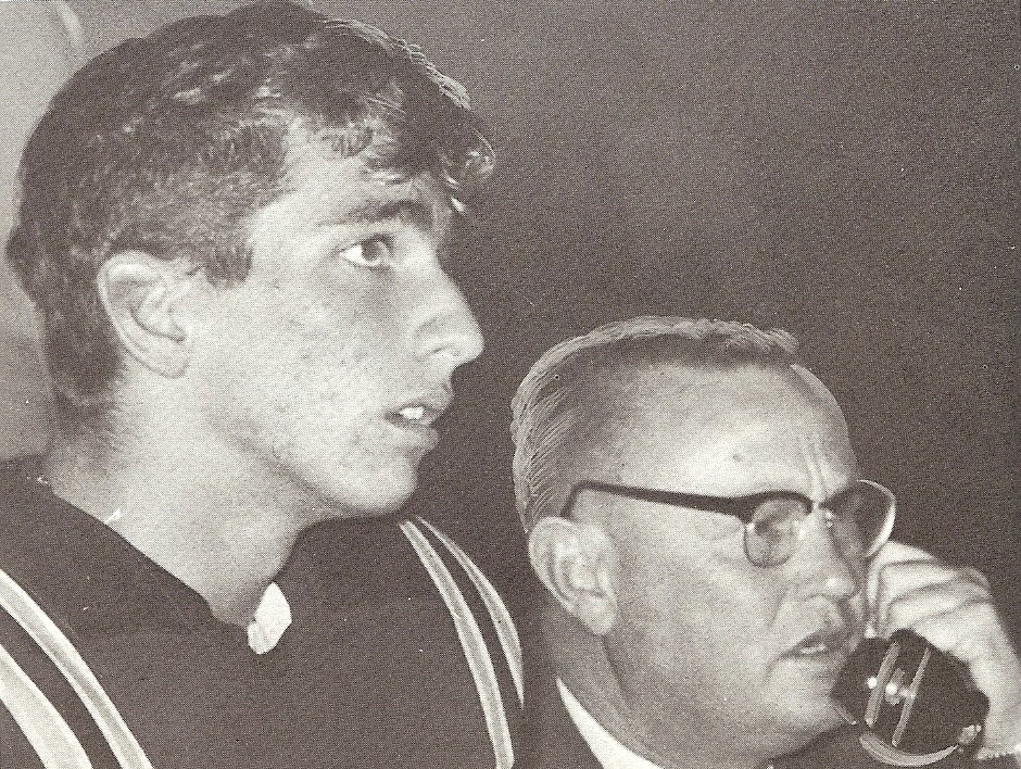 Point Loma quarterback Bob Kaye appears nonplussed, but coach Bennie Edens is much the unhappy camper as he talks to assistant coach on field-to-press box telephone. It was that kind of year for the Pointers.