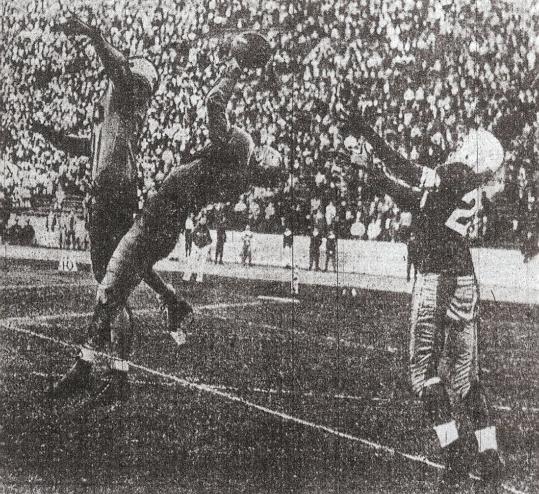 Holloway's pass to Ernie Smith in end zone was covered by Santa Monica defender defenders.